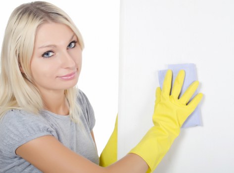 Cleaner refreshing a Catford office kitchen and communal area