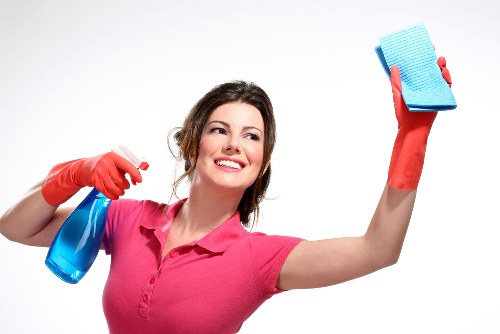 Professional cleaners maintaining desks, floors, and shared office spaces in Catford