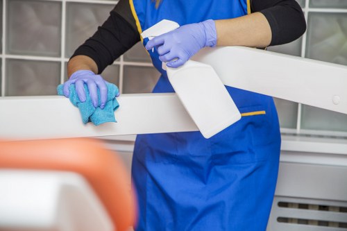 Professional cleaner resetting a bedroom for Airbnb guests